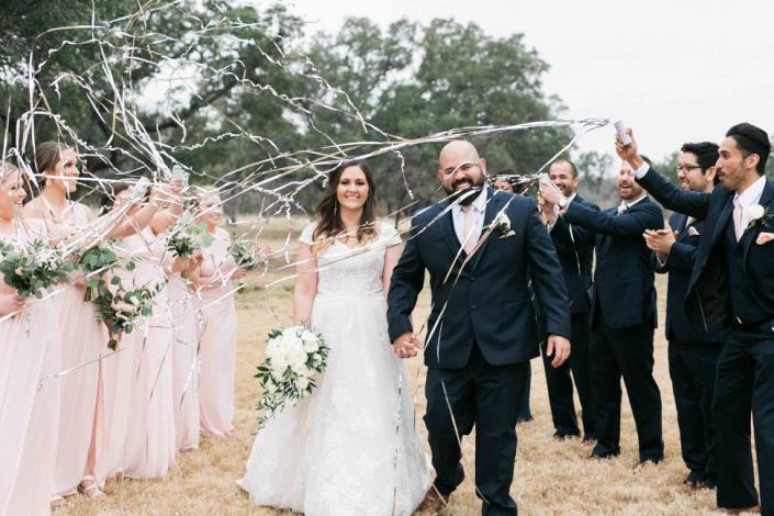 Bride and groom exit walk with fun streamers! 